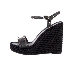 Valentino Garavani rockstud wedges in black.